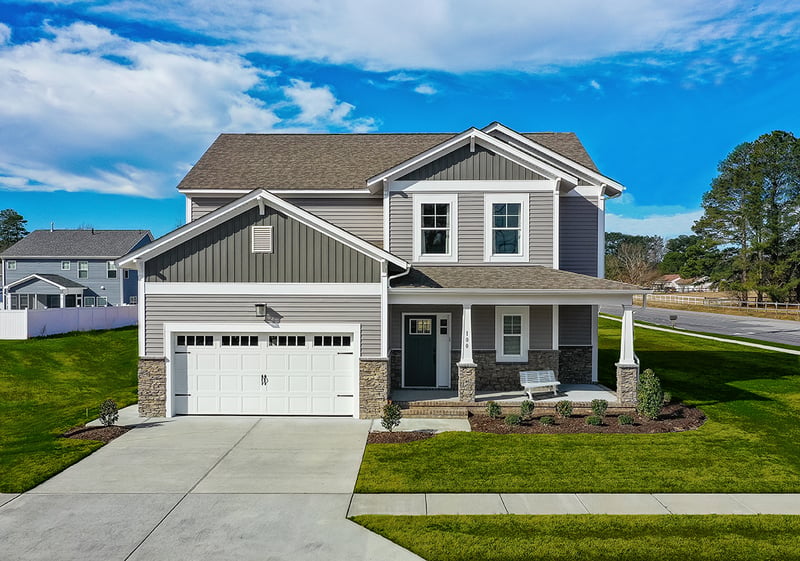 Royal® Residential D4 in Harvard Slate and Royal® Board & Batten Weathered Gray and Royal® Vinyl Trim in White