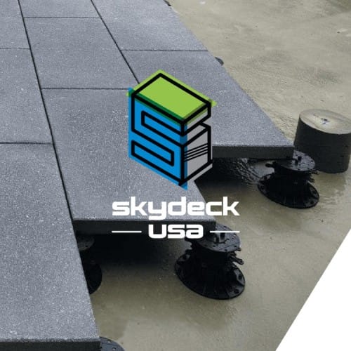 Porcelain pavers with factory-applied safety backing on pedestals